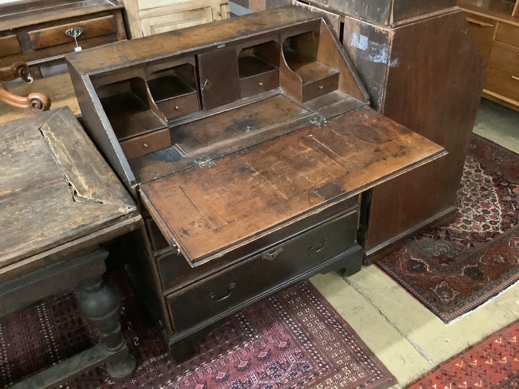 A mid 18th century oak bureau, width 88cm, depth 50cm, height 105cm